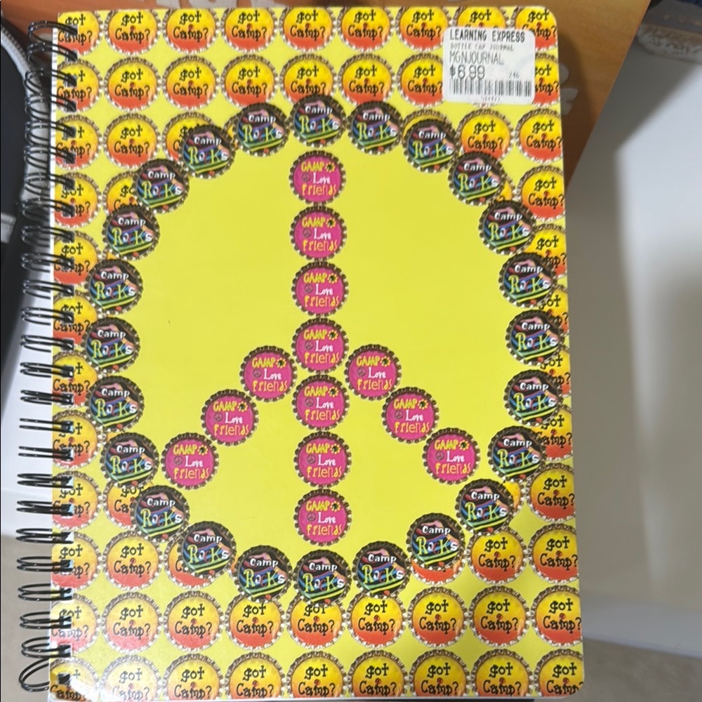 Yellow Spiral Notebook with Peace Sign Design